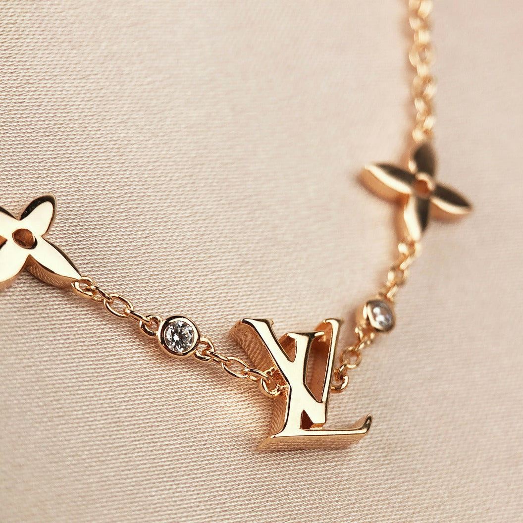 [AM]STAR AND SUN 7 MOTIFS GOLD BRACELET