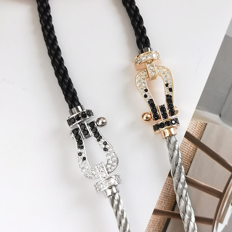 [AM]FORCE LARGE HORSESHOE BLACK & WHITE DIAMOND BRACELET - WHITE GOLD