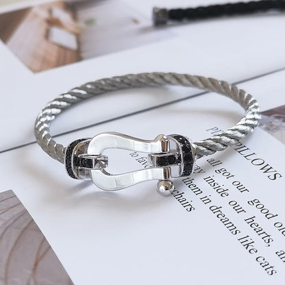 [AM]FORCE LARGE HORSESHOE BLACK DIAMOND BRACELET - WHITE GOLD