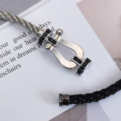 [AM]FORCE LARGE HORSESHOE BLACK DIAMOND BRACELET - WHITE GOLD